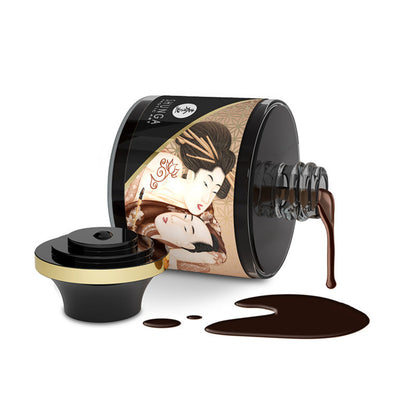 Shunga Aphrodisiac Chocolate edible body paint jar tipped on its side with rich dark chocolate paint dripping onto a white surface.