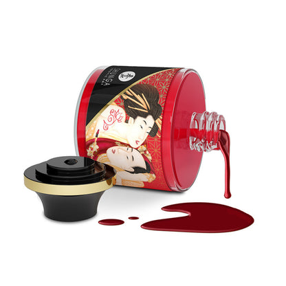 Shunga Sparkling Strawberry Wine edible body paint jar tipped over with glossy red syrup spilling alongside black and gold decorative cap.