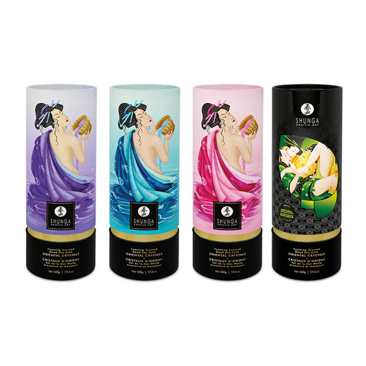 Four canisters of SHUNGA Oriental Crystals Foaming Dead Sea Salts in Purple, Blue, Pink, and Black, featuring traditional Japanese erotic art.