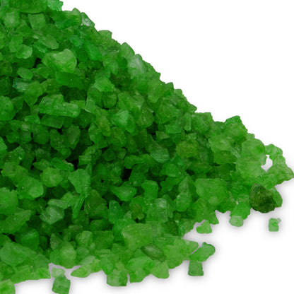 A detailed close-up of bright green "Lotus Flower" scented Dead Sea salt crystals.