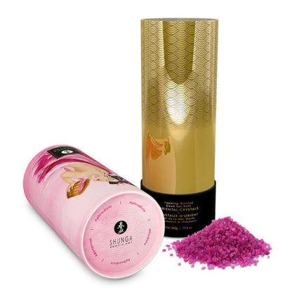 An open SHUNGA Rose Petal bath salt container showing the gold patterned interior, pink crystals, and the artistic outer lid.