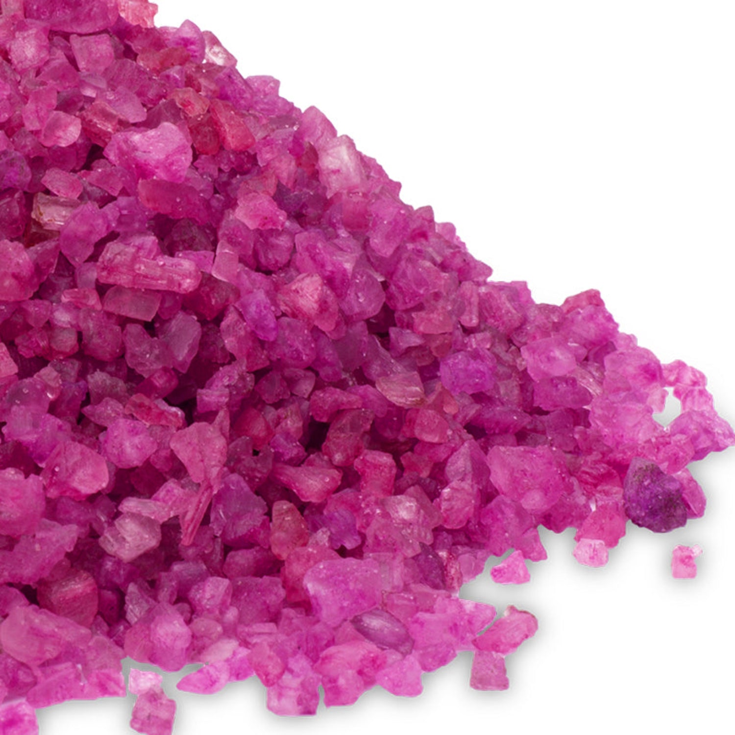 A textured close-up of bright pink "Rose Petal" (Aphrodisia) scented Dead Sea salt crystals.