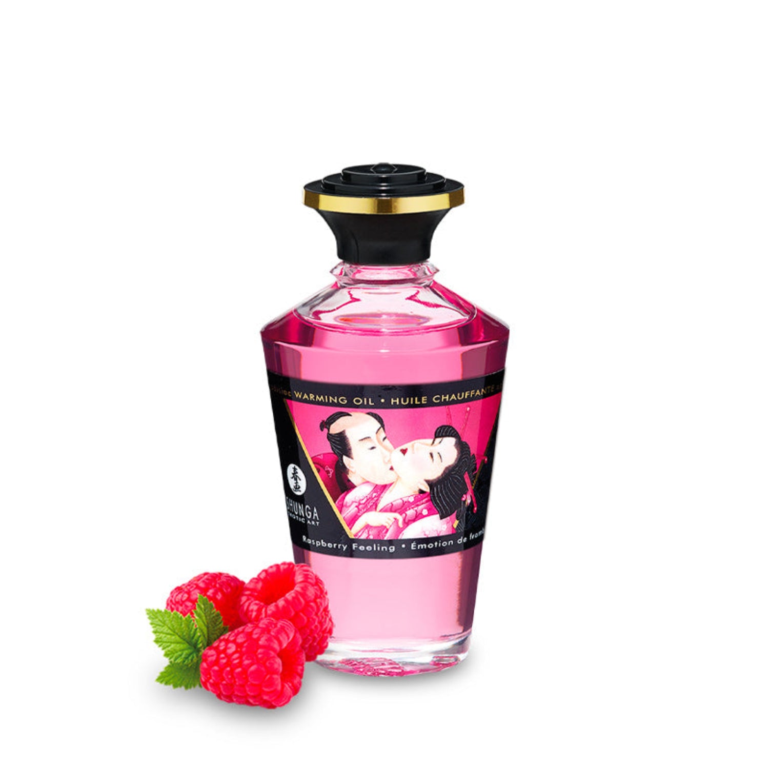 A pink bottle of SHUNGA Warming Aphrodisiac Oil in Raspberry Feeling, styled with fresh red raspberries.