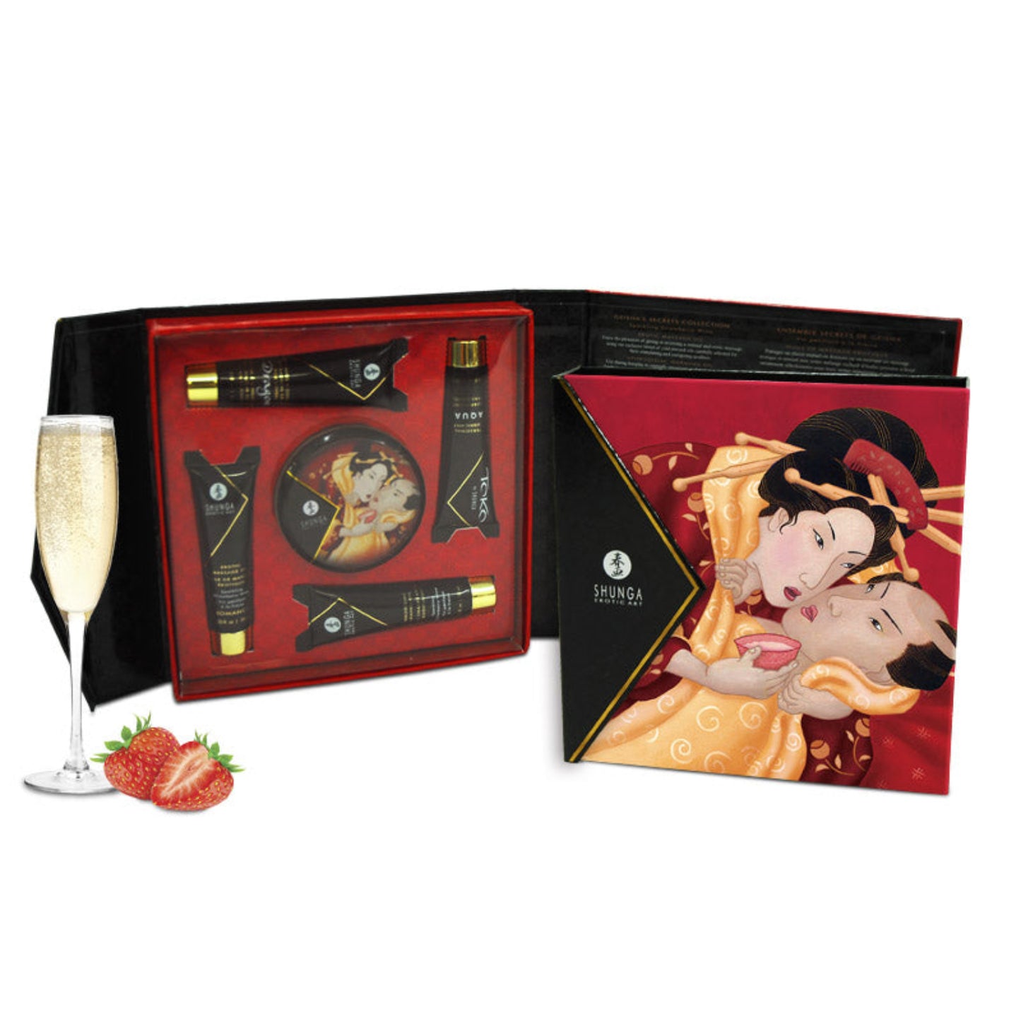 An open SHUNGA Geisha’s Secret gift box showing the five travel-sized pleasure products nestled in a red tray next to champagne and strawberries.