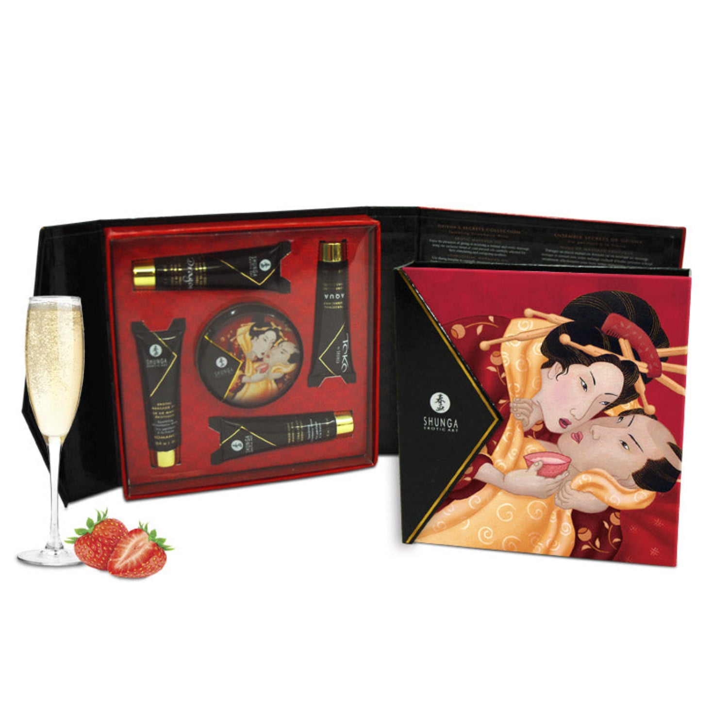 An open SHUNGA Geisha’s Secret gift box showing the five travel-sized pleasure products nestled in a red tray next to champagne and strawberries.
