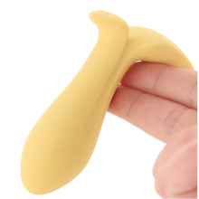 Load image into Gallery viewer, Image close up of the Satisfyer Intensity Plug Vibrator hanging upside-down of its base on two fingers.