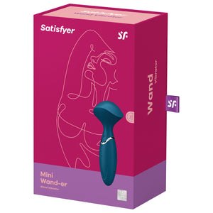 On the front of the package shows the Satisfyer logos, an image of the product, the product name: Mini Wand-er Wand Vibrator, and 15 year guaranatee stamp at the bottom right. On the right side of the packaging has "Wand Vibrator" printed, and a tag sticking out with the "SF" logo.