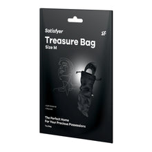 Load image into Gallery viewer, On the packaging are the Satisfyer logos, product name: Treasure Bag, Size M, an image of the Toy Bag with an adult Toy sticking out from the top, product features: Soft Material; Discreet, The Perfect Home for your Precious Possessions Toy Bag.