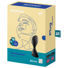Load image into Gallery viewer, On the front of the package are the Satisfyer logos, on the left side are smart devices compatible with free app, on the right side is an image of the product, product name: Trendsetter Plug Vibrator, on the bottom right is the bluetooth logo, and 15 year guarantee mark. On the right side of the image shows Plug Vibrator, a tag sticking out with the Sf logo, Get your free Satisfyer Connect App, Available on the Apple App store, Get it on Google Play, and below are images of compatible smart devices.