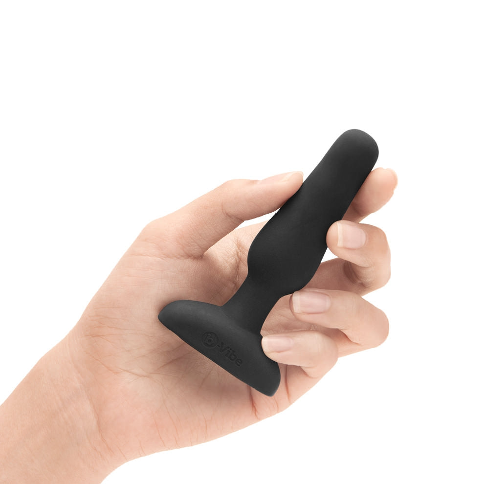 b-Vibe Novice Plug gently held, showing the size scale of the product.