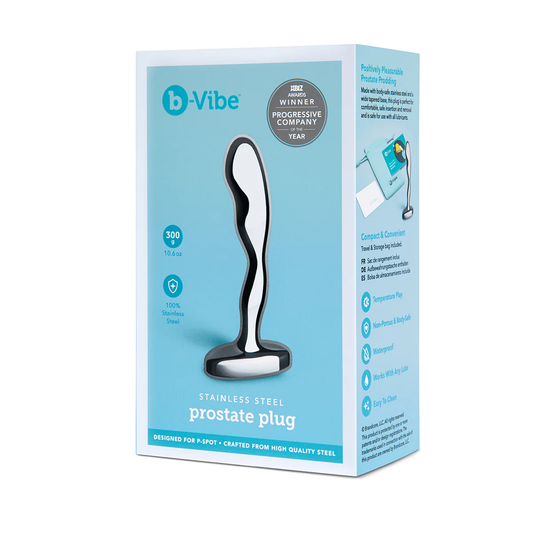 On the front of the packaging is the b-Vibe's logo, product features: 300 g / 10.6 oz; 100% stainless steel, an image of the product; Product name: Stainless steel prostate plug; Designed for P-Spot; Crafted from high quality stainless steel, and on the top right corner is a stamp for "Xbiz awards winner Progressive company of the year". On the right side of the packaging are descriptive texts: Positively pleasurable prostate prodding