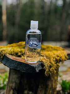 Boy Butter Clear Water Based Personal Lubricant Model shot on a tree stump