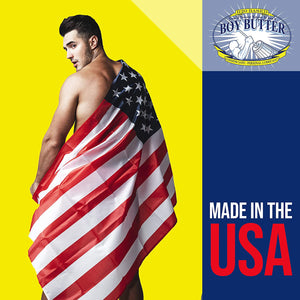 On the left side of the image is an image of looking at a back of a shitless man covered by an American flag, as he is looking back over his shoulder. Top right is H2O Based You'll never know it isn't Boy Butter Condom safe - premium lubricant logo, and below is a caption: Made in USA.
