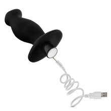 Load image into Gallery viewer, blush Anal Adventures Platinum Vibrating Prostate Massager 2 with a charging cable connecting to the charging port at the back of the product, underneath the power button.