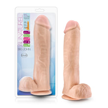 Load image into Gallery viewer, On left side of image is product packaging. On product packaging is written Au Naturel 11.5 inch Sensa Feel dual density with an illustrated diagram of product: Soft outer layer; Firm inner core; Flexible spine, Phthalate free; Lab certified body safe; Fragrance free; Flexible spine; Suction cup base, Big John, with blush logo underneath. In centre is a cutout for product display. On right side of image is the product blush Au Naturel Big John Dildo.