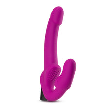 Load image into Gallery viewer, Top side view of the blush Temptasia Estella Strapless Dildo, standing on its base.