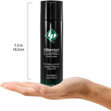 Load image into Gallery viewer, Size guide for ID Millennium Long Lasting Pure Silicone Lubricant Ultra Slippery 8.5 fl. oz. (250 ml) compared to a human hand. The height of the bottle is 7.3 inches or 18.5 centimetres.