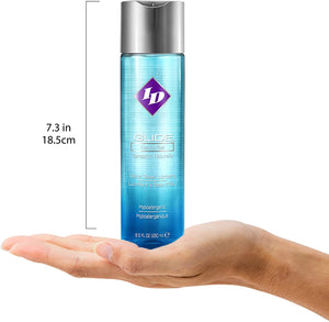 ID Glide Natural Feel Sensation Water-Based Lubricant Hypoallergenic 8.5 fl oz (250 ml) bottle height 7.3 inches / 18.5 centimetres, standing up on the palm of a hand for size reference.