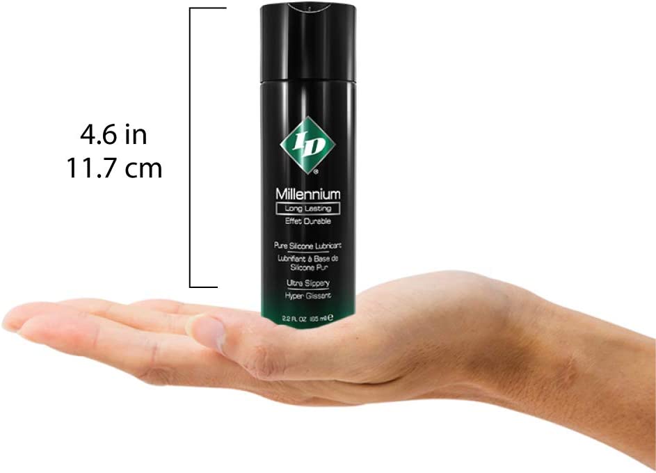 Size guide for ID Millennium Long Lasting Pure Silicone Lubricant Ultra Slippery 1 fl. oz. (30 ml) compared to a human hand. The height of the bottle is 4.6 inches or 11.7 centimetres.