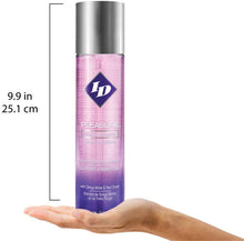 Charger l&#39;image dans la galerie, Size scale for ID Pleasure Tingling Sensation Water Based Lubricant with Ginko Biloba &amp; Red Clover 17 fl oz (500 ml) comapred to a human hand. The height of the bottle is 9.9 inches or 25.1 centimetres.