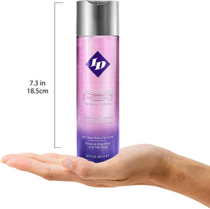 Size scale for ID Pleasure Tingling Sensation Water Based Lubricant with Ginko Biloba & Red Clover 8.5 fl oz (250 ml) compared to a human hand. The height of the bottle is 7.3 inches or 18.5 centimetres.