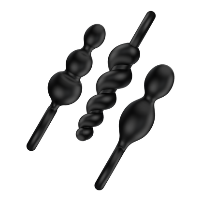 Satisfyer Booty Call Black Plugs placed diagonally side view.