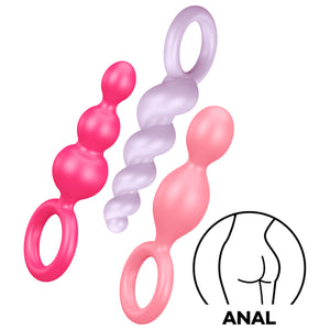 Satisfyer Booty Call Plugs Coloured variantProduct one pink plug, one light purple plug, and one light pink plug. Icon for ANAL.