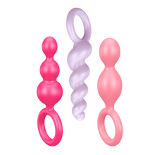 Load image into Gallery viewer, Satisfyer Booty Call Plugs coloured variant. One pink plug, upside down light purple plug, and a light pink plug.