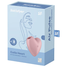 Charger l&#39;image dans la galerie, Front of the Satisfyer Cutie Heart Air Pulse Stimulator + Vibration. Pink front left side view of the product, and 15 year guarantee. On the side of the package is written Air Pulse Stimulator + Vibration, and a tag with a &quot;sf&quot; logo.
