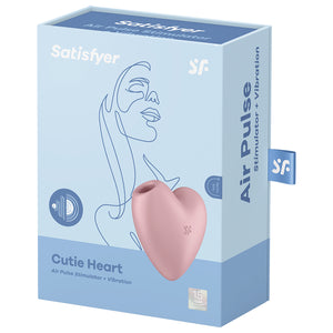 Front of the Satisfyer Cutie Heart Air Pulse Stimulator + Vibration. Pink front left side view of the product, and 15 year guarantee. On the side of the package is written Air Pulse Stimulator + Vibration, and a tag with a "sf" logo.