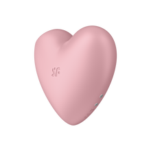 Load image into Gallery viewer, Satisfyer Cutie Heart Air Pulse Stimulator on the left side of the product showing the &quot;sf&quot; logo, and on the back side charging port visible.