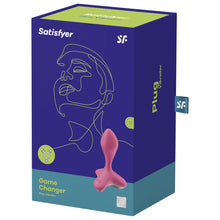 Load image into Gallery viewer, Front of the package for the Satisfyer Game Changer Plug Vibrator. Satisfyer logos on the top, on the bottom left is written Game Changer Plug Vibrator in Lime Green on the right is the front side from the top view of the plug vibrator with the power button visible on the left side of the product. On the right side of the package is writen Plug Vibrator, and a tag with the &quot;SF&quot; logo sticking out from the side.