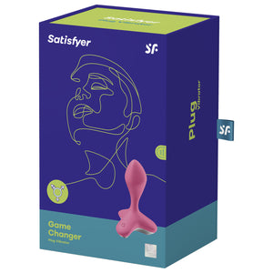 Front of the package for the Satisfyer Game Changer Plug Vibrator. Satisfyer logos on the top, on the bottom left is written Game Changer Plug Vibrator in Lime Green on the right is the front side from the top view of the plug vibrator with the power button visible on the left side of the product. On the right side of the package is writen Plug Vibrator, and a tag with the "SF" logo sticking out from the side.