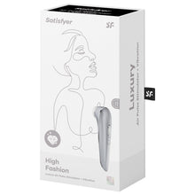 Load image into Gallery viewer, Front of the package for the Satisfyer High Fashion Luxury Air Pulse Stimulator + Vibration. On the left side is a diamond icon representing luxury, and on the right side is the Air Pulse Stimulator facing front side with the controls visible on the handle. 15 Yeah Guarantee icon is on the bottom right. On the right side of the package is written Luxury Air Pulse Stimulator + Vibration.