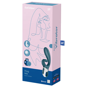 Front of package for Satisfyer Hug Me Rabbit Vibrator, on top are the Satisfyer logos, on the left side icon for bendable, an icon with gears and x2 indicating for two motors, and an icon with smart devices + Free App indicating Satisfyer Connect App compatibility, on right side is the Hug Me Vibrator facing front, and on bottom right is a bluetooth logo, and a 15 year guarantee mark. On right side of the package is written Rabbit Vibrator.