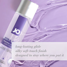 Load image into Gallery viewer, A bottle of JO XTRA Silky Personal Lubricant Ultra-Thin Silicone Original laying in lubricant. Long-lasting glide, silky soft-touch finish, designed to stay where you put it.