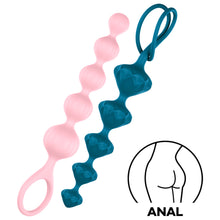 Load image into Gallery viewer, Satisfyer Love Beads Super Soft Silicone Beads, on the left side is light pink with rounded beads, and on the right is dark blue with diamond shaped beads. On the bottom right of the image is an icon for ANAL.