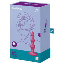 Load image into Gallery viewer, Front of the package for Satisfyer Lolli Plug 1 Plug Vibrator, on the top are the Satisfyer logos, on the left side is an icon with gears and a x2 indicating dual motors, on the right side is the Lolli Plug, and on the bottom right is the 15 year guarantee mark. On the right side of the package is written plug vibrator, with a label sticking out from the back with the SF logo.
