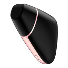 Load image into Gallery viewer, Front side of the black Satisfyer Love Triangle Air Pulse Stimulator with the front cover on. Charging port is visible on the bottom of the product.