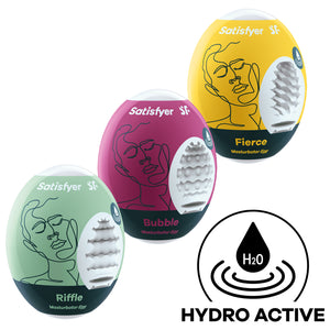 Three Satisfyer Masturbator Eggs top to bottom is yellow Fierce, purple Bubble, and light green Riffe. On the bottom right is an icon with an H2O drop indicating Hydro Active.