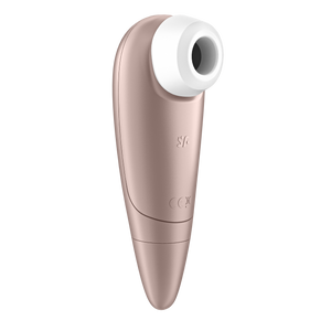 Front left side of the Back of the Satisfyer Number One Air Pulse Stimulator, on the top is visible inside the head, and on the middle part of the product is the SF logo.