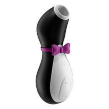 Load image into Gallery viewer, Front side of the Satisfyer Penguin Air Pulse Stimulator, to the middle right of the product below the bow tie is the SF logo engraved, and on the bottom of the product are the intensity controls marked by arching air waves facing away from each other. 