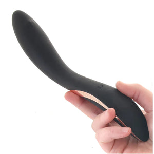 The Satisfyer Rrrolling Explosion Vibrator is held from the bottom front facing up, with the SF logo visible at the top of the handle.