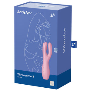Front of the package from the top are the Satisfyer logos, on the bottomleft is the product name Threesome 3 Vibrator, on the right side is the product facing front left, with partial controls visible on the left side of the product, and on the bottom right is a mark for 15 year guarantee. On the right side of the package is written Vibrator, and from the back is a tag sticking out with the SF logo.
