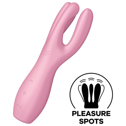 Satisfyer Threesome 3 Vibrator diagonally facing front and to the left, with the controls visible on the lower part of the handle marked by -, + and a horizontal wave, on the top is engraved SF logo. On the bottom right of the image is an icon for Pleasure Spots.