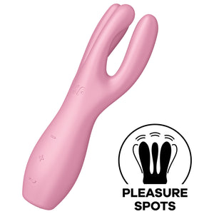 Satisfyer Threesome 3 Vibrator diagonally facing front and to the left, with the controls visible on the lower part of the handle marked by -, + and a horizontal wave, on the top is engraved SF logo. On the bottom right of the image is an icon for Pleasure Spots.
