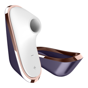 Front side of the Satisfyer Traveler Air Pulse Stimulator with the cover beside the product. On the bottom part of product are the controls marked by - and +.